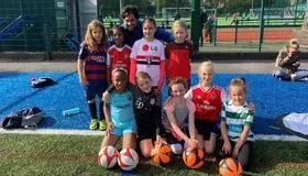 Girls laughing together after football training at European Football Academy - girls football programme in London