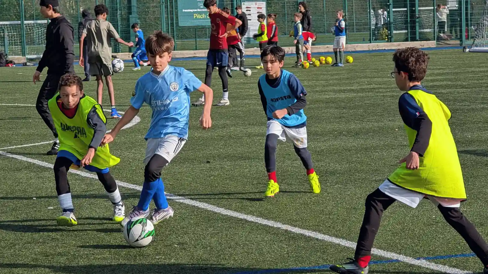 Football Camps London — players training in small groups with UEFA-qualified coaches