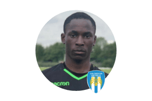 One talented young footballer (goalkeeper), former European Football Academy player, progressing to top-tier football. Pictured in Colchester kit, showcasing the academy's success in developing future stars in London, UK.