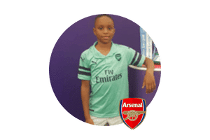 One talented young footballer (winger), former European Football Academy player, progressing to top-tier football. Pictured in Arsenal kit, showcasing the academy's success in developing future stars in London, UK.
