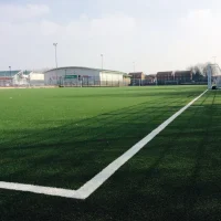 Football training at Whitefield School near Brent Cross, London, with young athletes practicing on a professional-grade pitch.